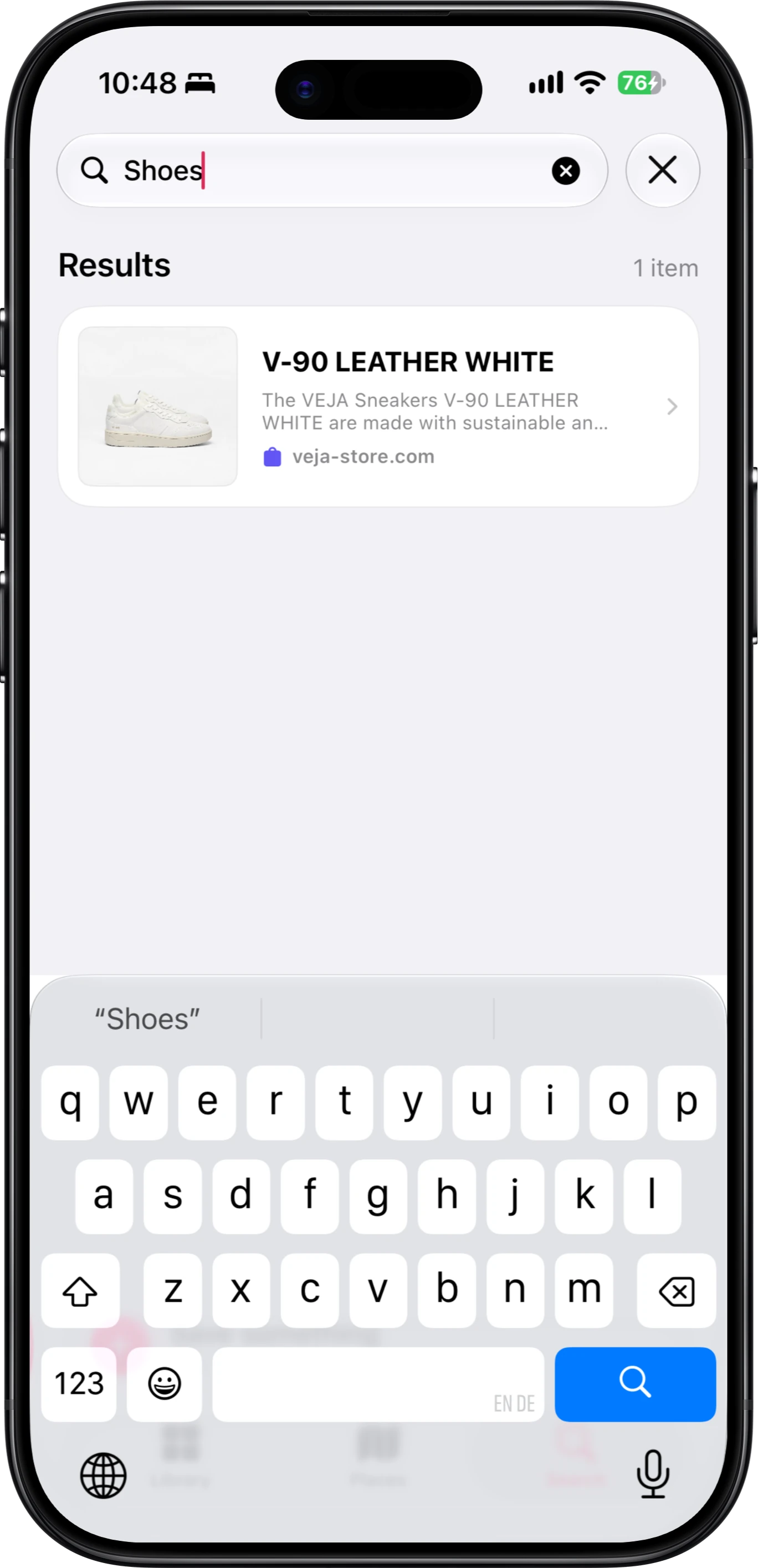 Search in FaveNest on iPhone, with “Shoes” typed into the field, one result for a pair of white VEJA sneakers from veja-store.com under Results, and the keyboard open below.